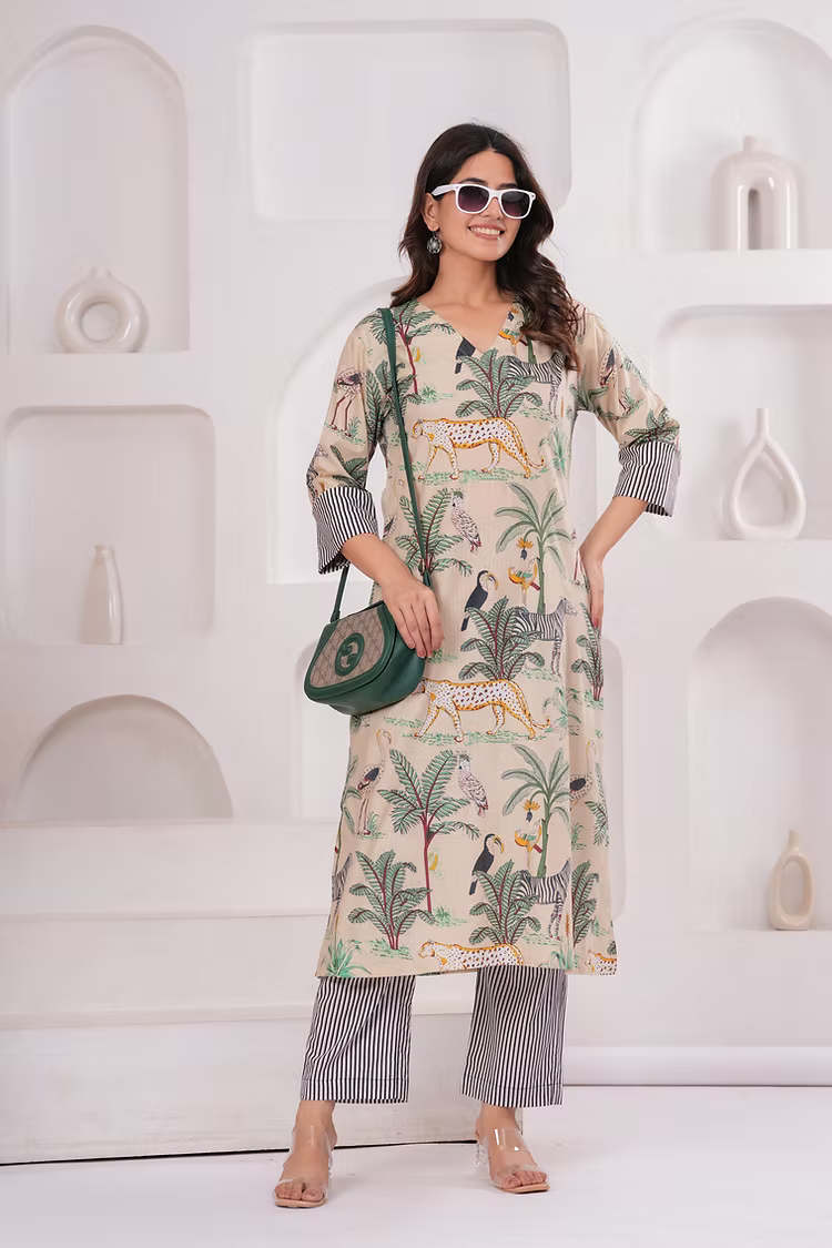 Woman wearing a patterned outfit with a white background