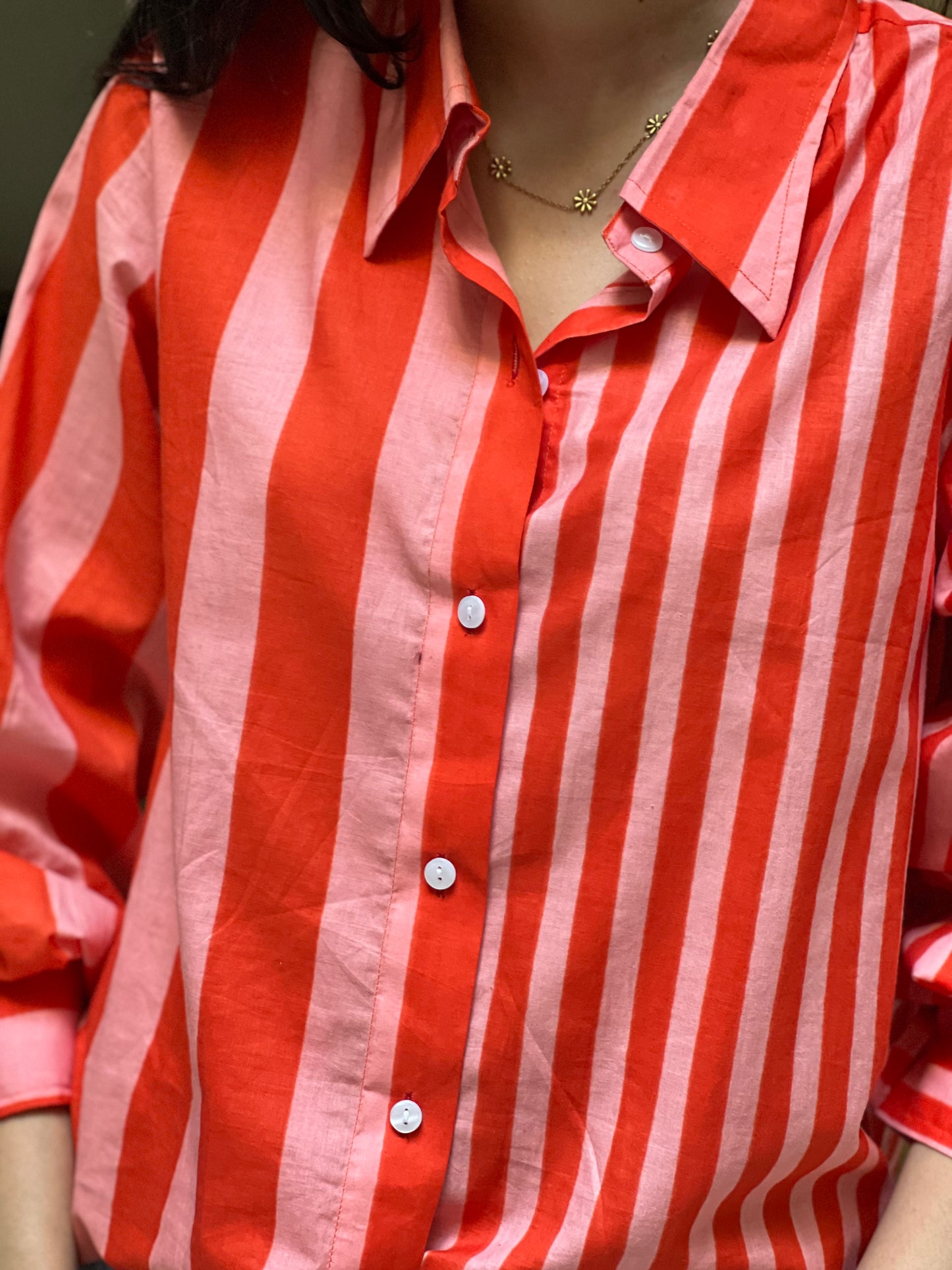Red and white striped shirt with a necklace