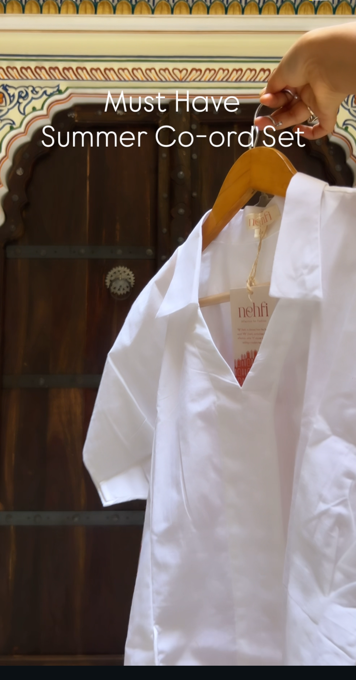 White shirt on a hanger with text 'Must Have Summer Co-ord Set' against a dark background.