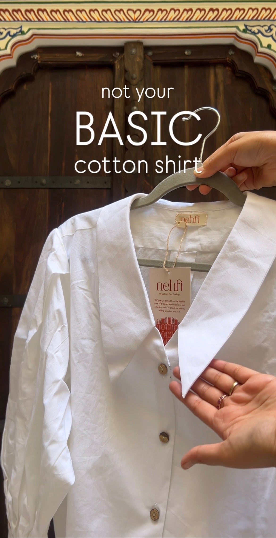White cotton shirt on a hanger with 'not your BASIC cotton shirt' text and Nehru label.